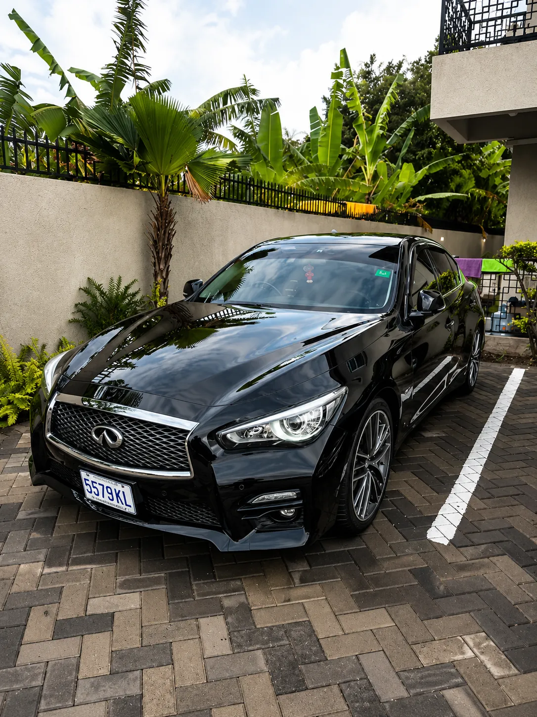 Black Infiniti sedan with a deep gloss finish